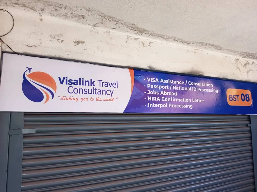 Original Visa Link office sign above the entrance in Kyengera